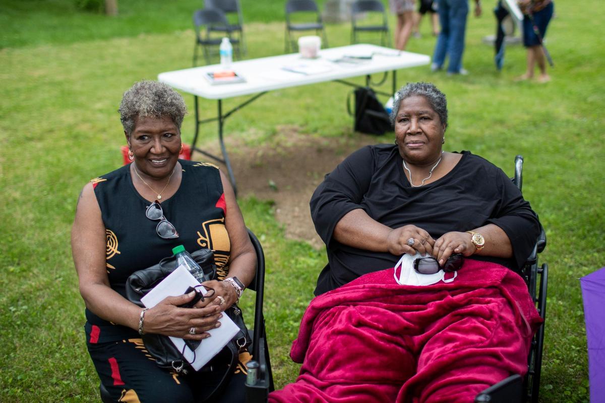 Marcia L. Wilson and her sister Alesia Adams Dell ‘Orto at a dedication ceremony for markers for their relatives Ann Scott and Henry Dunham, who were relatives of Paul Laurence Dunbar, at African Cemetery #2 in Lexington, Ky., Saturday, May 21, 2022.