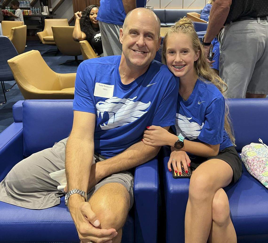 In a surgery performed on July 11, former Kentucky men’s basketball player Todd Svoboda, left, had his right leg amputated above the knee. He is pictured with his daughter, Eliana.