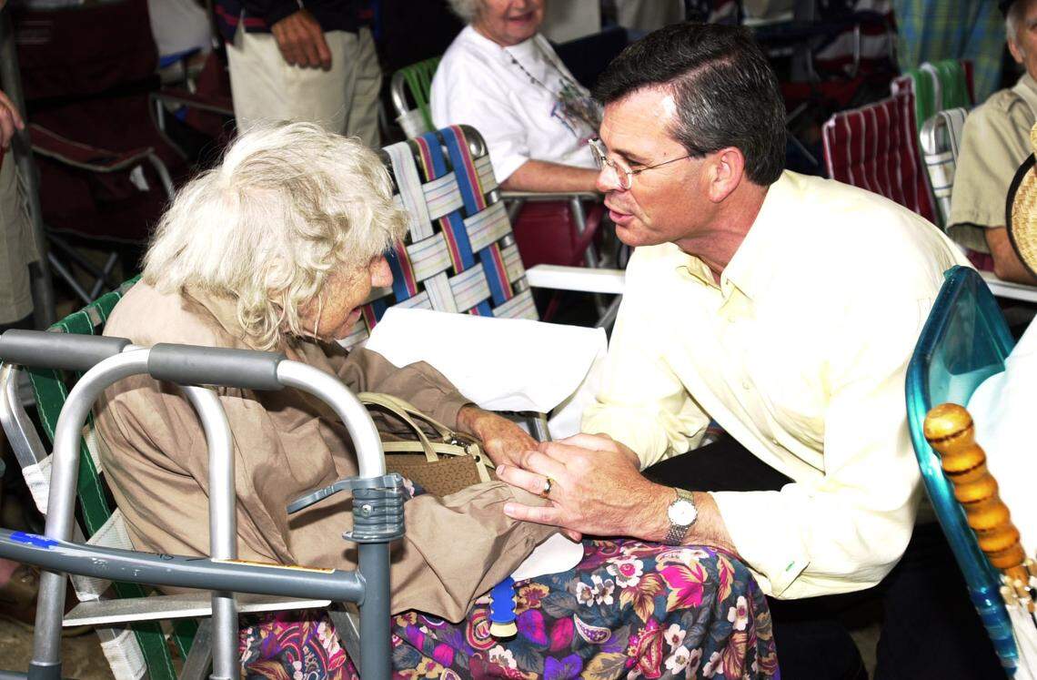 Congressman and candidate for Gov. of Kentucky, Ernie Fletcher talks with Iva Sharp, 84 years old from Princeton, Ky. at the Fancy Farm picnic.,on Sat. afternoon. Today, August 2, 2003, marks the 123th meeting of politicians that gather at Fancy Farm, Kentucky to campaign for the up coming November elections. The event draws Kentuckians from all over the State, especially in election years.