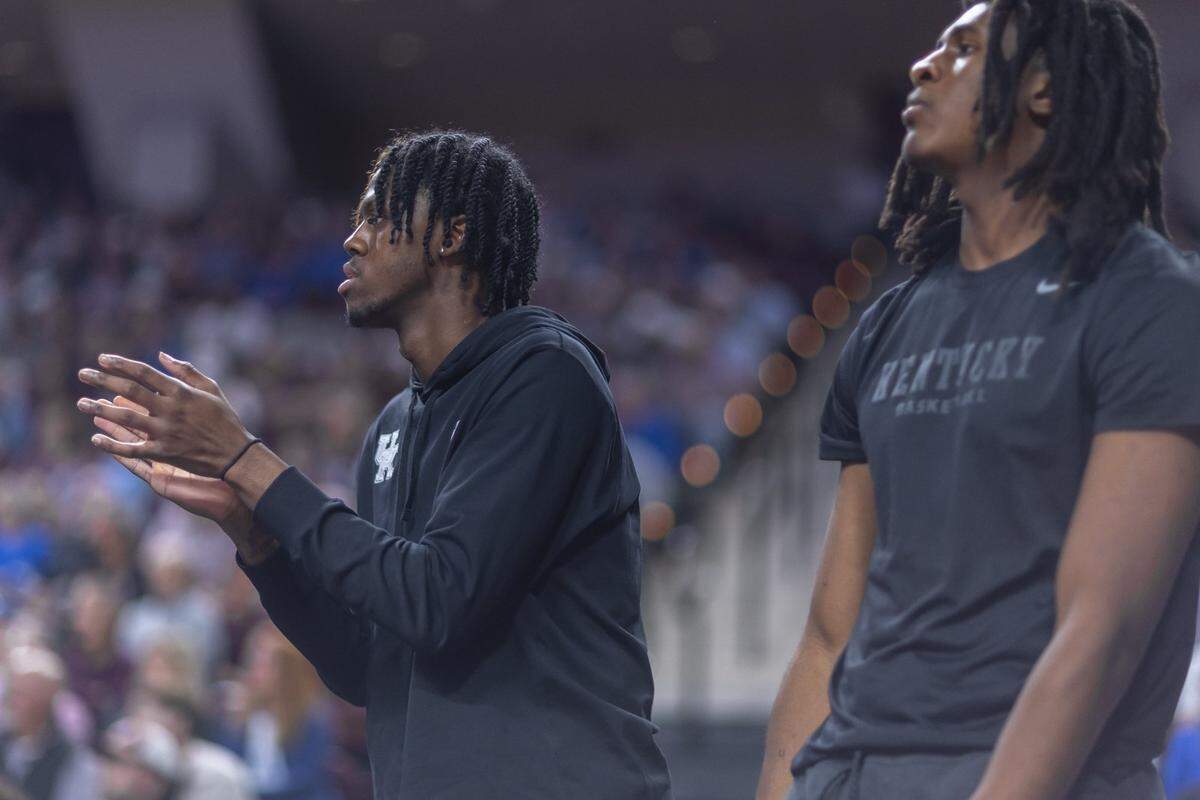 Kentucky basketball wing Kam Williams (left) and forward Jayden Quaintance (right) cheer on the Wildcats during a game against Texas A&M at Reed Arena in College Station, Texas, on Tuesday, March 3, 2026.