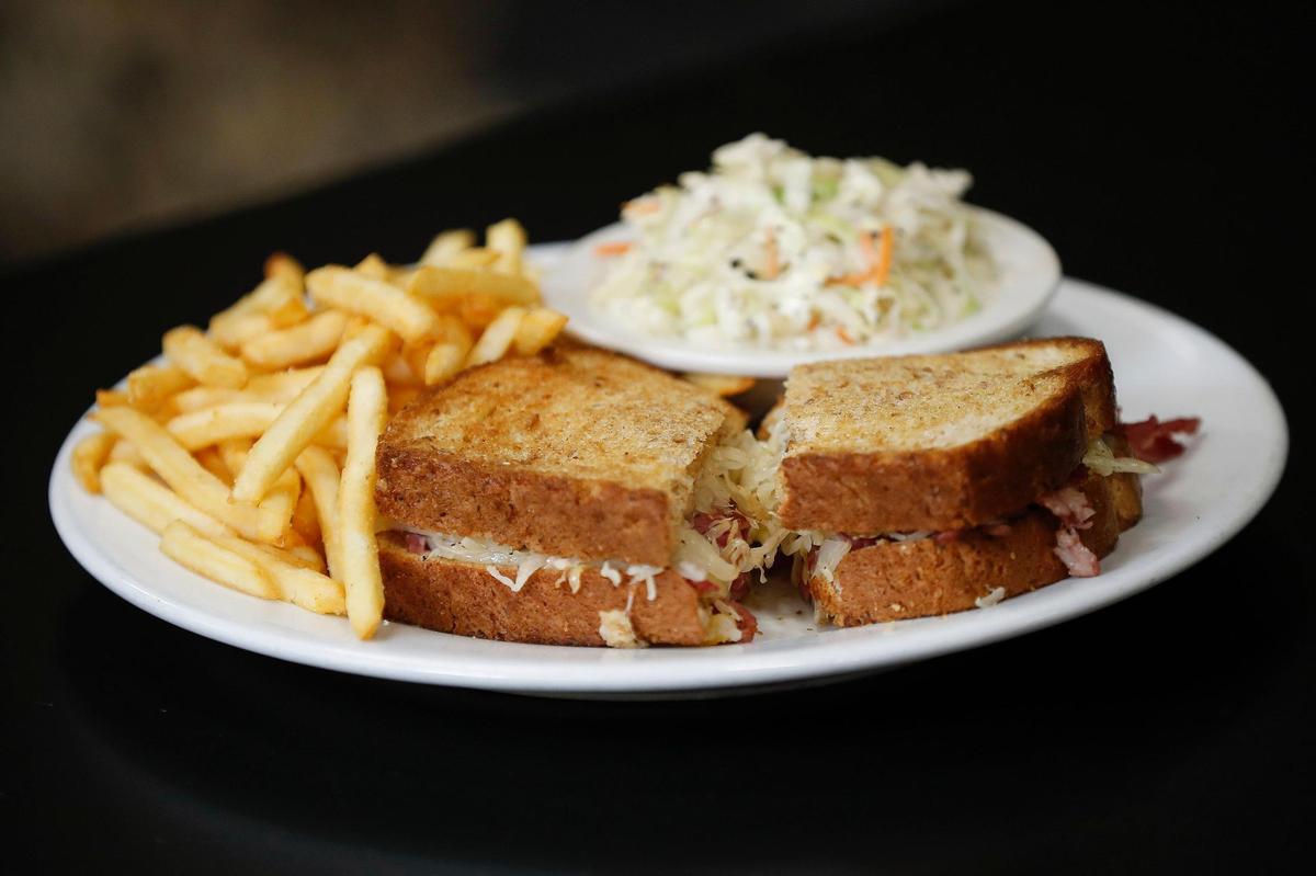The Rueben made with corned beef, sauerkraut, Swiss cheese and Thousand Island dressing and served with french fries and coleslaw at The Cattle Drive restaurant at the Blue Grass Stockyards.