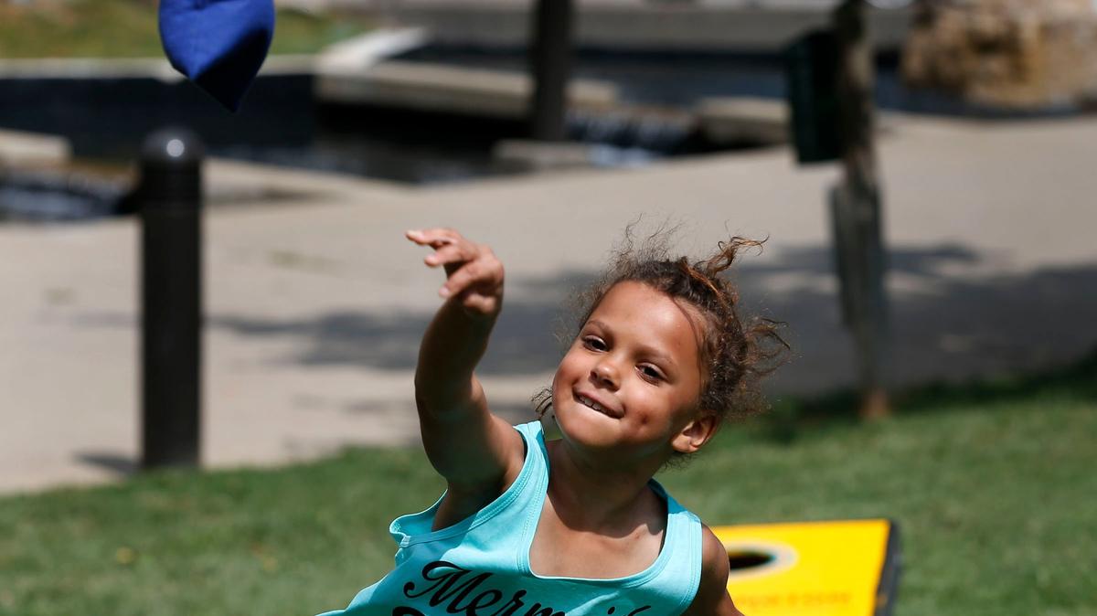 Rhea Core, 8-years-old, tossed a bean bag at Phoenix Park in 2018 as Lexington Parks and Recreation helped kids experience the magic of summer camp with the Park and Play van.