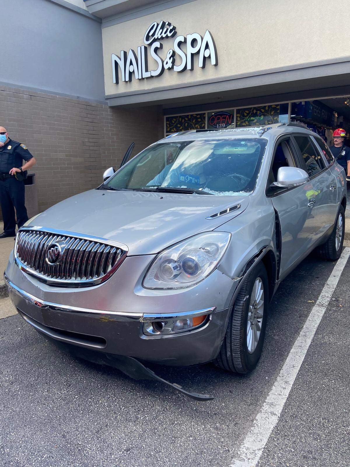 The silver Buick Enclave appears to incur minimal damage
