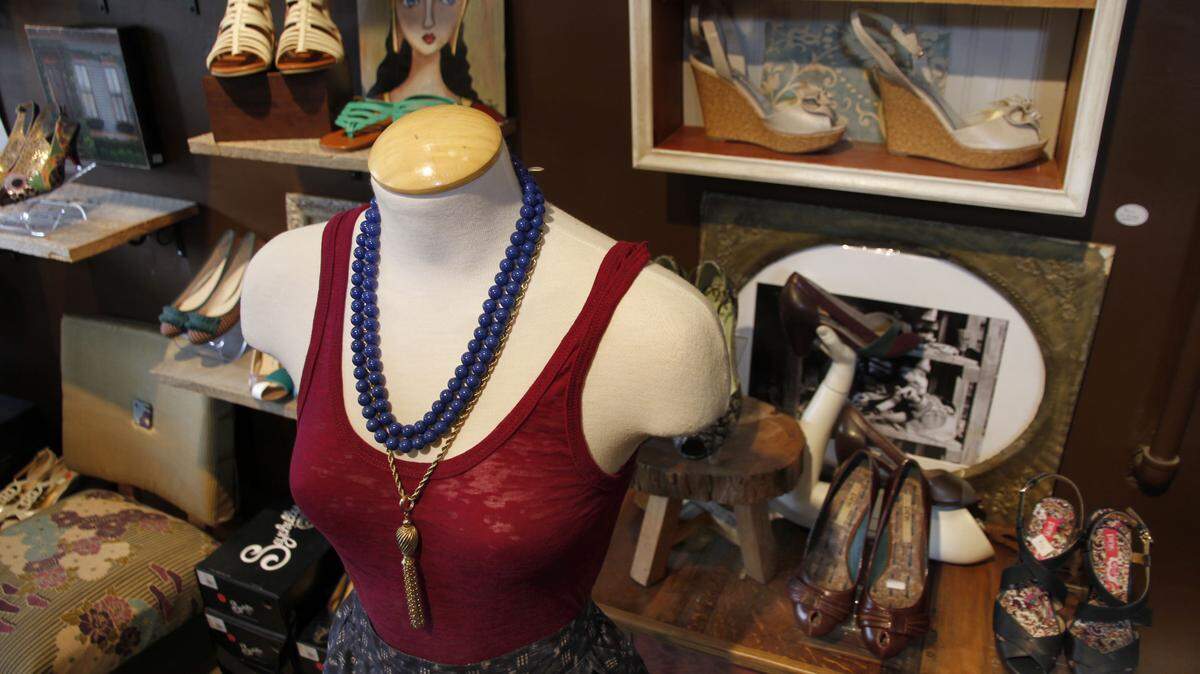 On the mannequin at Black Market is a top by Alternative; the necklace is vintage. Black Market carries a lot of vintage, and it stocks shoes that other boutiques might not carry.  