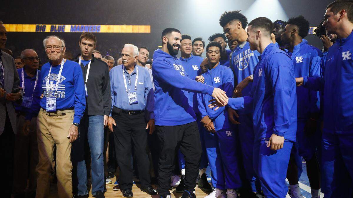 Drake, center, greeted past and present members of the Kentucky men's basketball team during Big Blue Madness at Rupp Arena on Oct. 13, 2017.  The rap/R&B artist has twice visited Madness during Coach John Calipari's tenure.