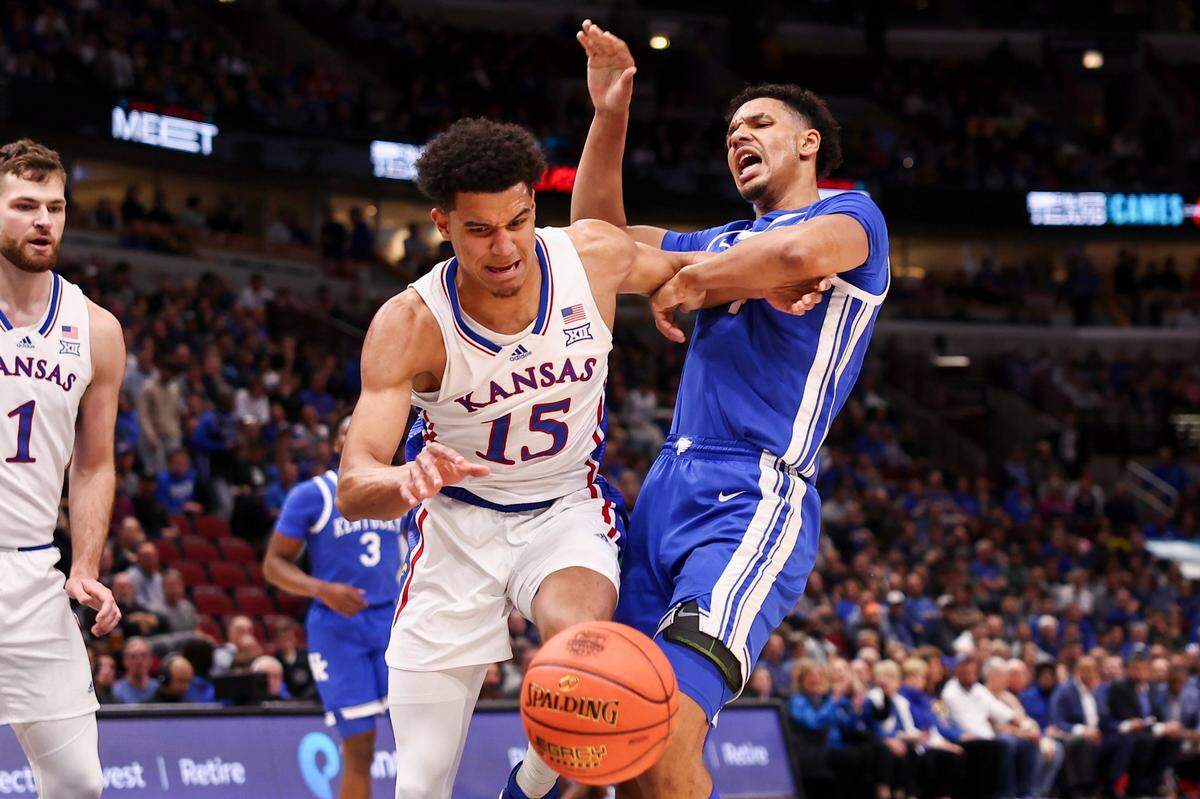 Kansas Jayhawks guard Kevin McCullar Jr. (15) fights for a rebound against Kentucky Wildcats forward Tre Mitchell (4) during the State Farm Champions Classic at the United Center in Chicago, IL, Tuesday, November 14, 2023.