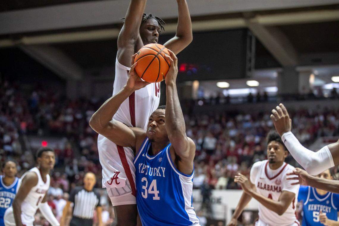 Kentucky’s Oscar Tshiebwe (34) tries to get a shot off against Alabama’s Charles Bediako on Saturday at Coleman Coliseum in Tuscaloosa, Ala.