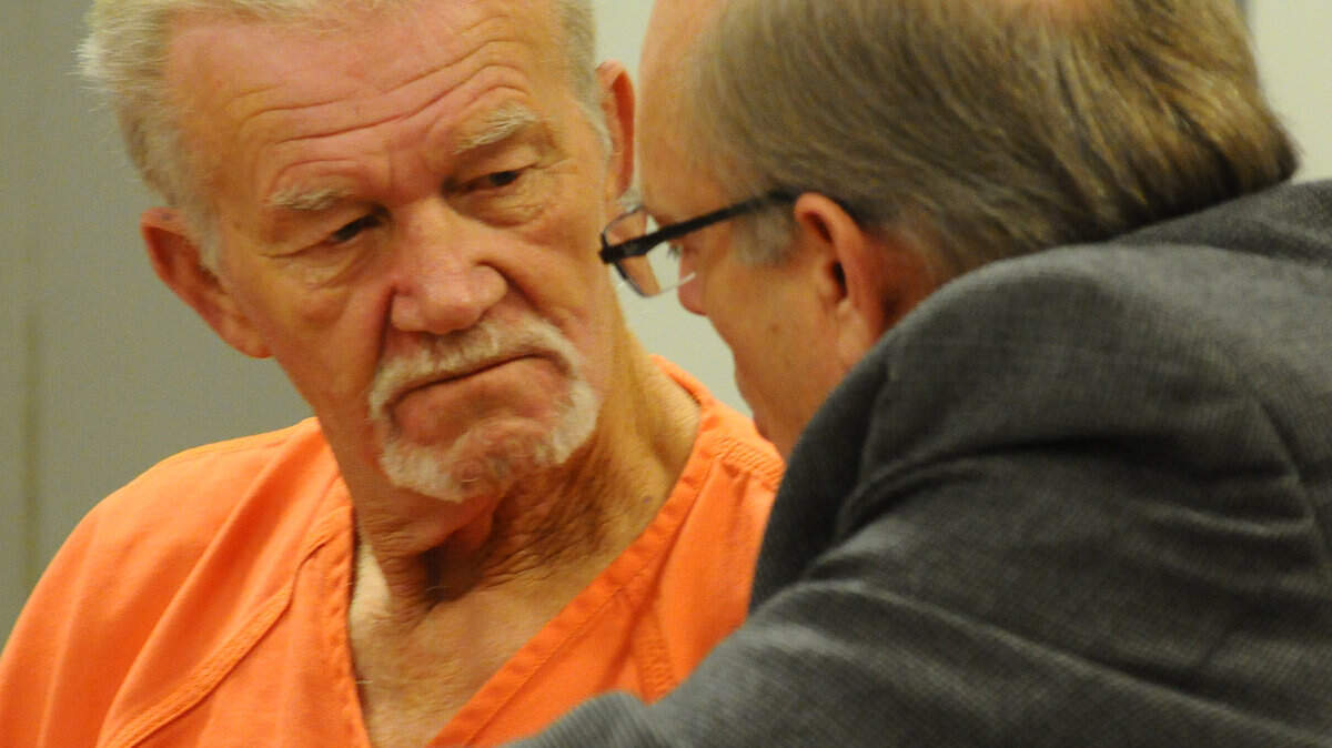 Marty Roe talks with his attorney Marc S. Triplett after Wednesday's hearing in Logan County, Ohio, on Nov. 16, 2011. Photo by Joel Mast | Bellefontaine Examiner
