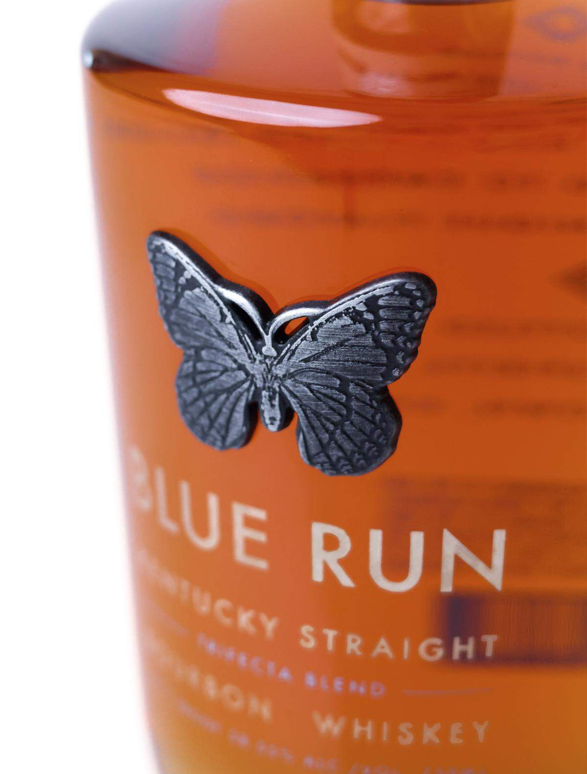 The signature butterfly on the latest Blue Run bottle is pewter, a blend of three metals, in honor of Trifecta’s blend of three bourbons.
