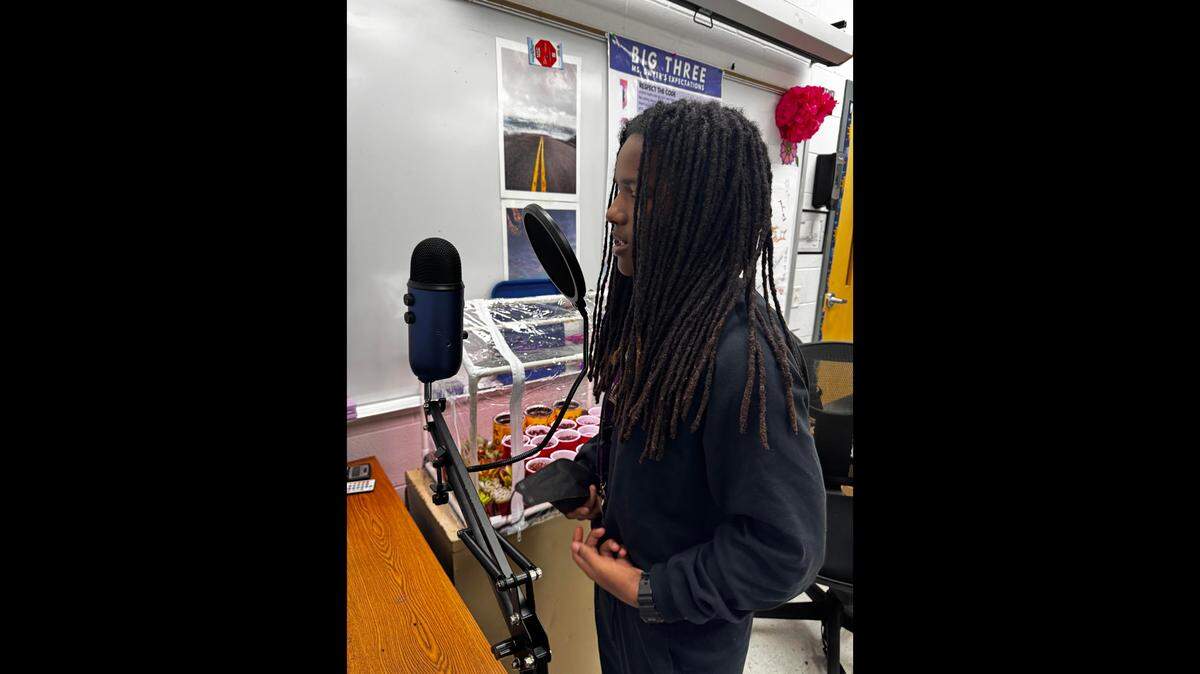 Najavia Chenault, 15, records songs in a classroom at Martin Luther King Jr. Academy as part of a project.