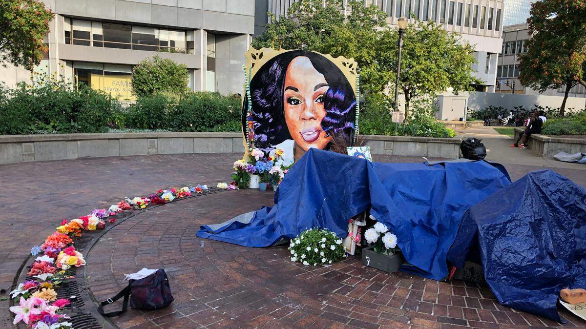 A memorial to Breonna Taylor in downtown Louisville is covered up for the night on Wednesday August 26, 2020. Taylor was killed by police in her apartment.