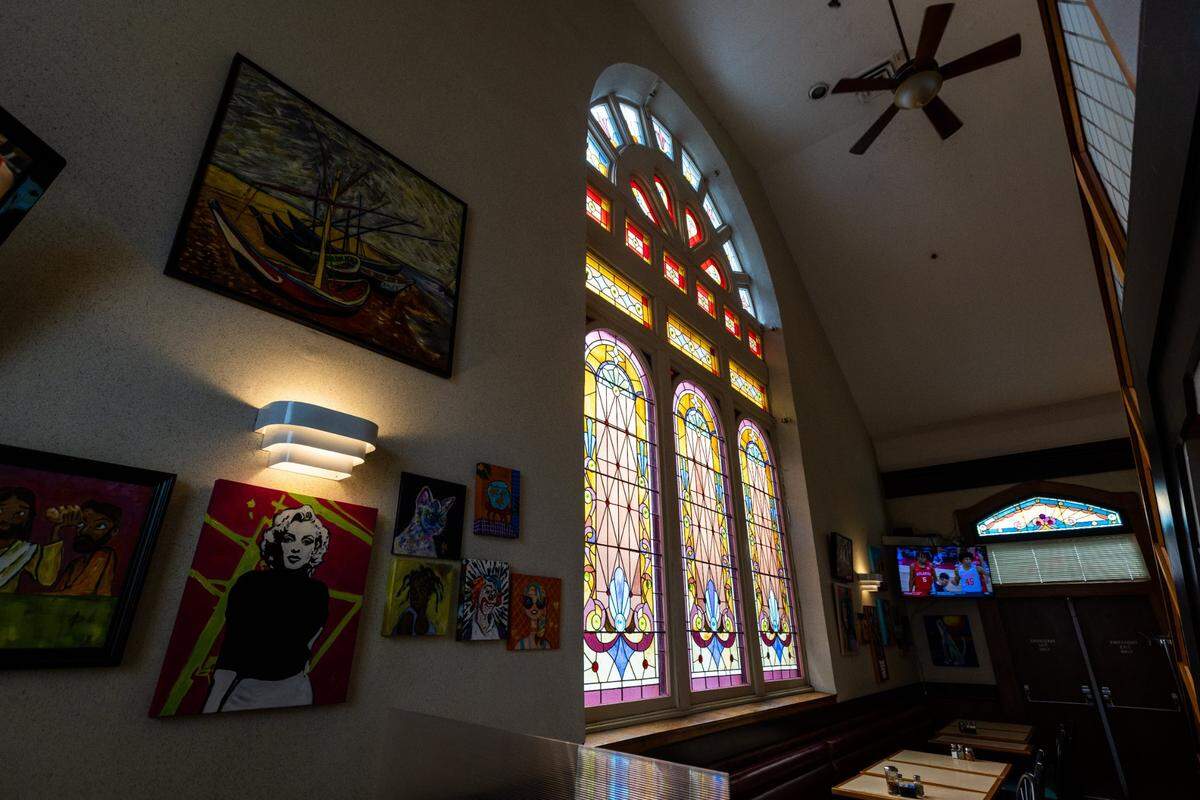 Stain glass windows of Joe Bologna’s Restaurant on Maxwell Street, August 17, 2021, which was built in 1891 as the Maxwell Street Presbyterian Church before being rededicated as a Jewish Synagogue, then as a restaurant in 1989.