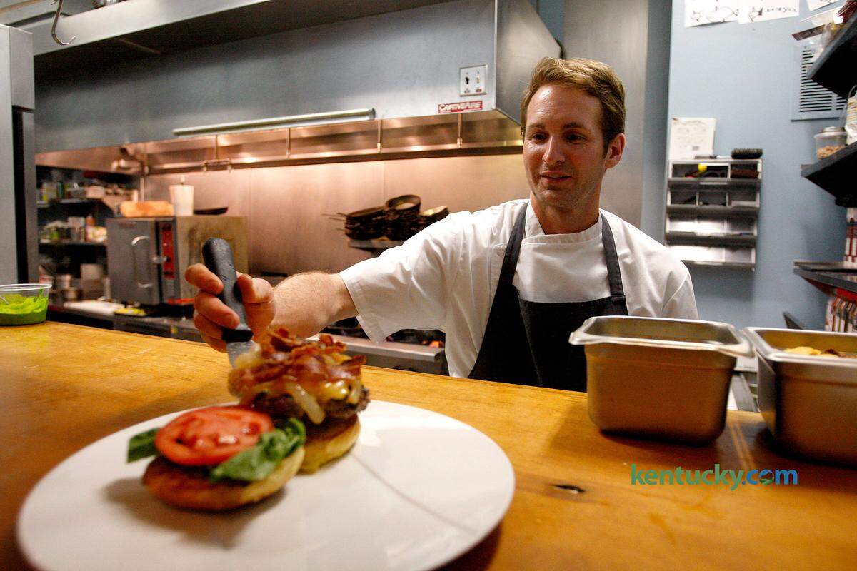 Chef Mark Wombles completes the Mary Burger at Heirloom restaurant in Midway in 2014.