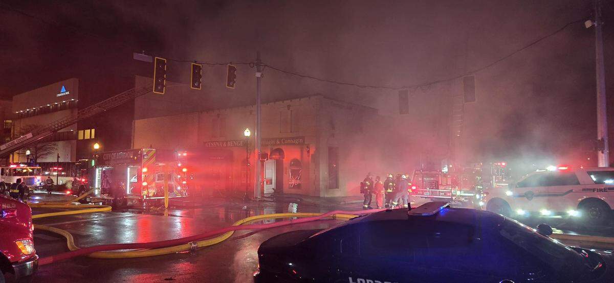 Smoke fills the air while firefighters battle a fire in downtown London, Ky., Jan. 13, 2026.