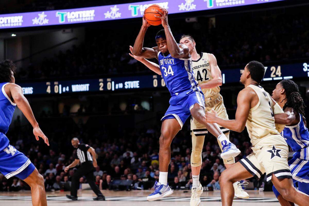 Kentucky’s Oscar Tshiebwe (34) gets a rebound against Vanderbilt’s Quentin Millora-Brown (42) during Tuesday’s game at Memorial Gymnasium in Nashville.