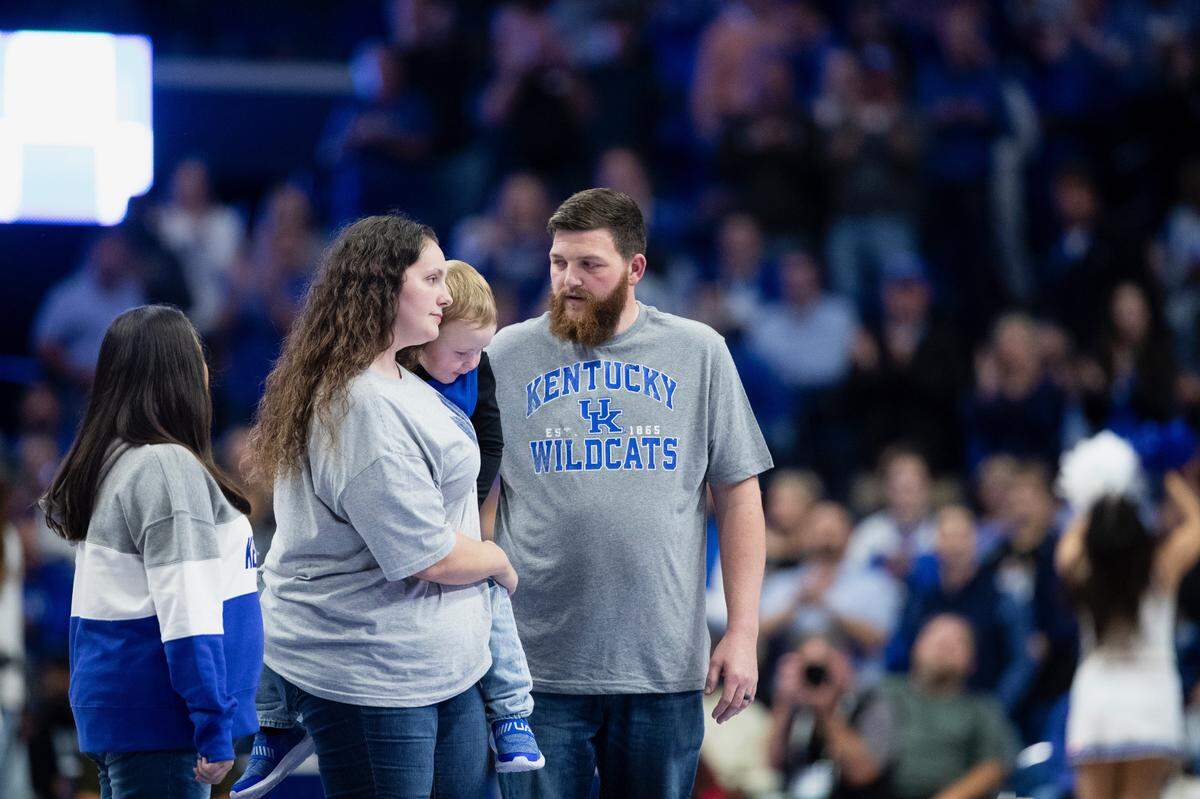 Michael McGuire and his family are honored during the game between Kentucky and Duquesne on Friday night.