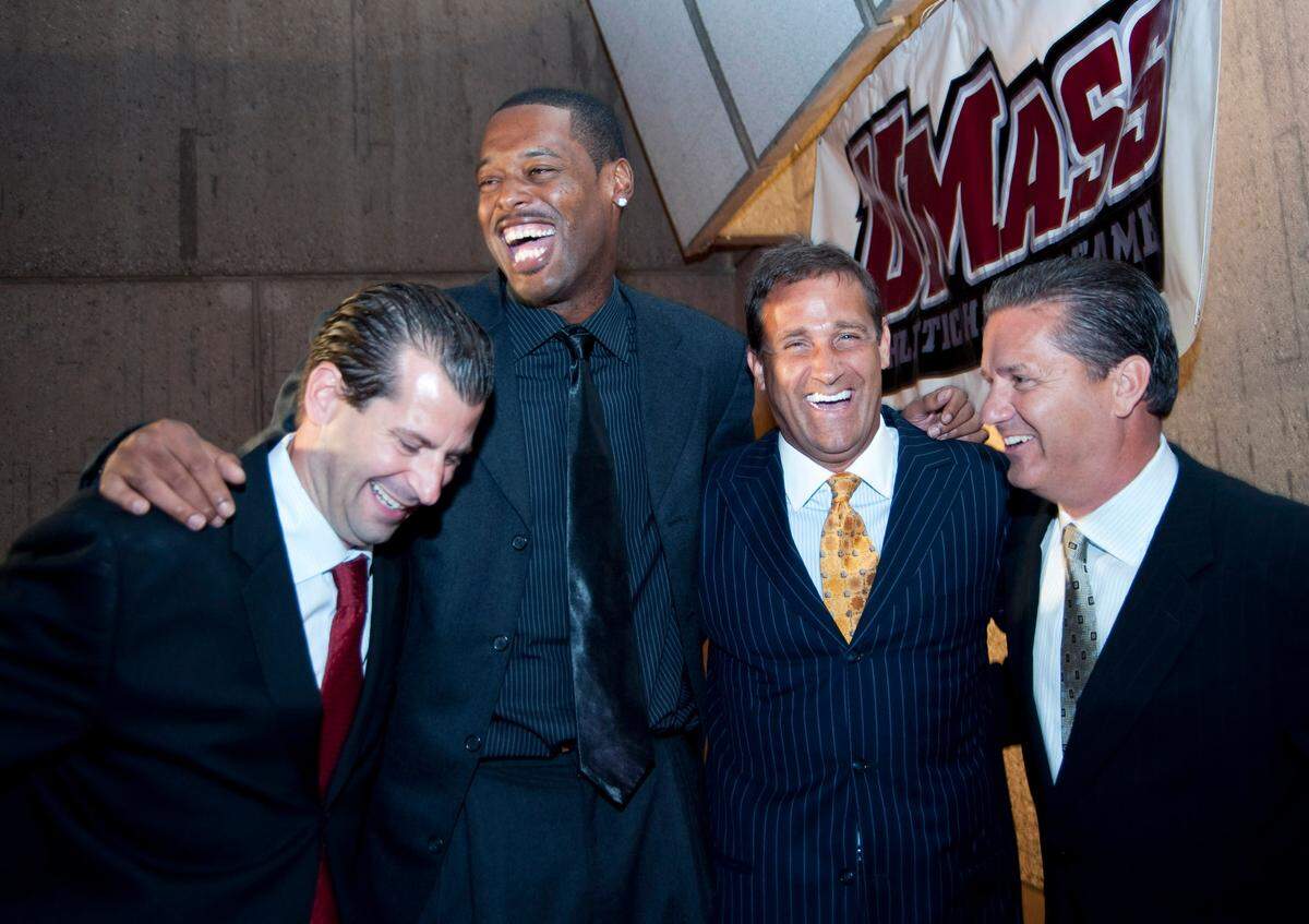 Former UMass basketball star Marcus Camby, second from left, shares some laughs with (from left) Derek Kellogg, Bill Bayno and John Calipari.