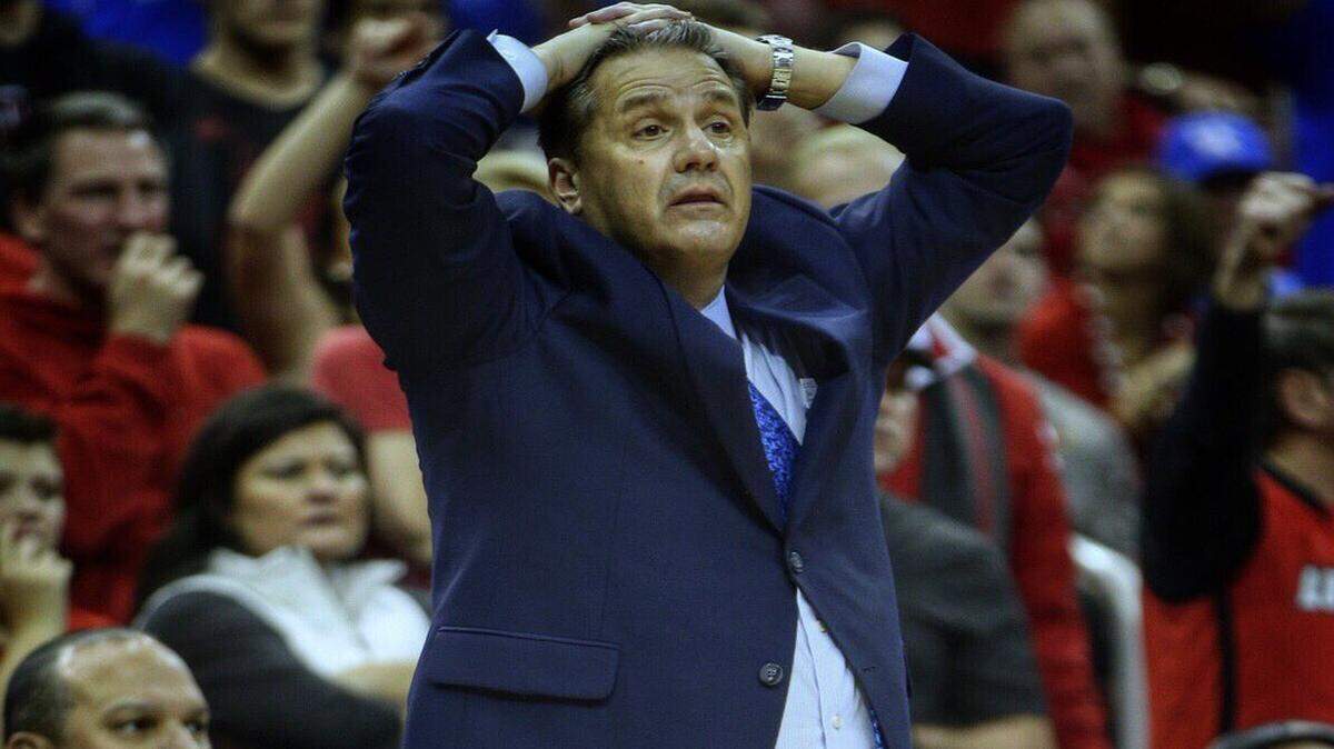 John Calipari reacted to officiating and other issues with the Wildcats in 73-70 loss to Louisville in the Yum Center Wednesday night.