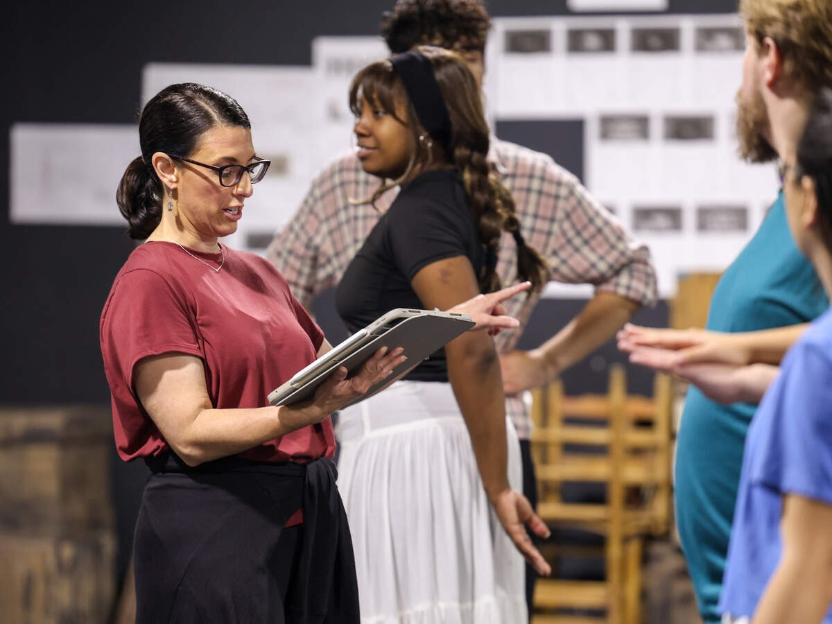 Lyndy Franklin Smith, co-director, works with the company to bring the scenes of “Les Misérables” to life.