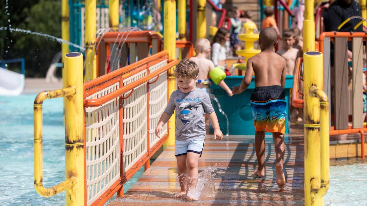 Children play on and near the newest pool feature at the Woodland Aquatic Center: Paradise Lagoon, a shipwreck-themed feature at Woodland Aquatic Center at Woodland Park in Lexington, Ky., Friday, May 26, 2023.