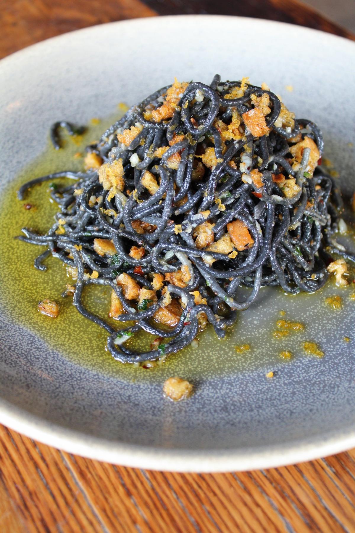The d’Abruzzo ($18) at Crust pizza and pasta restaurant is made with the squid ink tonnarelli pasta, bottarga (often called “poor man’s caviar”), garlic, chili and topped with garlic herb breadcrumbs.