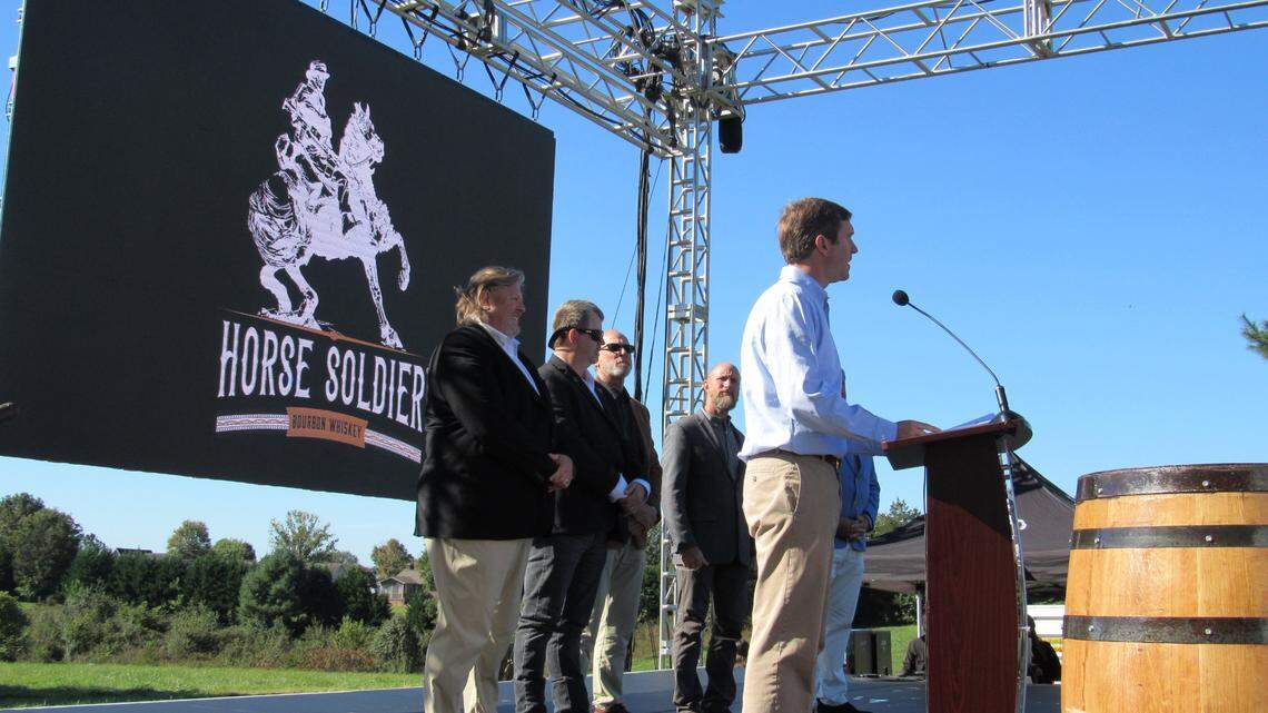 Gov. Andy Beshear prepared to present Kentucky Colonel certificates on Oct. 19. 2021 to officials with Horse Soldier Farms, which plans to build a bourbon distillery and other attractions in Somerset, Ky.