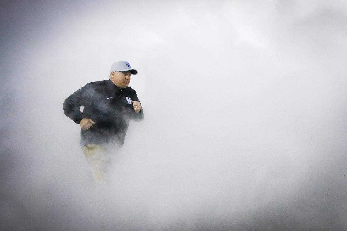 Kentucky Wildcats head coach Mark Stoops takes the field before a game against the Missouri Tigers at Kroger Field in Lexington, Ky., Saturday, Oct. 26, 2019.