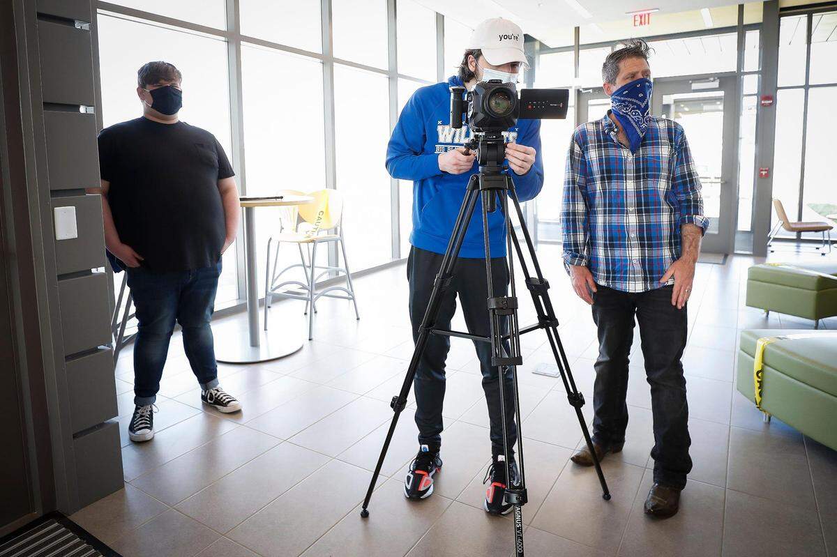 From left, Bluegrass Community & Technical College students Brady Posey and Jordan Helton work with adjunct professor Matthew Kistenmacher as they film “The Covid Monologues” March 26 at BCTC in Lexington. The livestream was recognized by the Region IV Kennedy Center American College Theatre Festival and now the theater program is turning it into a movie.