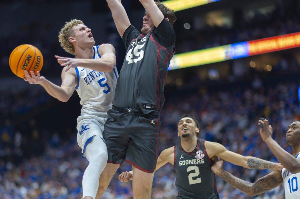 Kentucky guard Collin Chandler (5) drives against Oklahoma’s Luke Northweather (45) during Thursday’s game at Bridgestone Arena in Nashville, Tennessee.