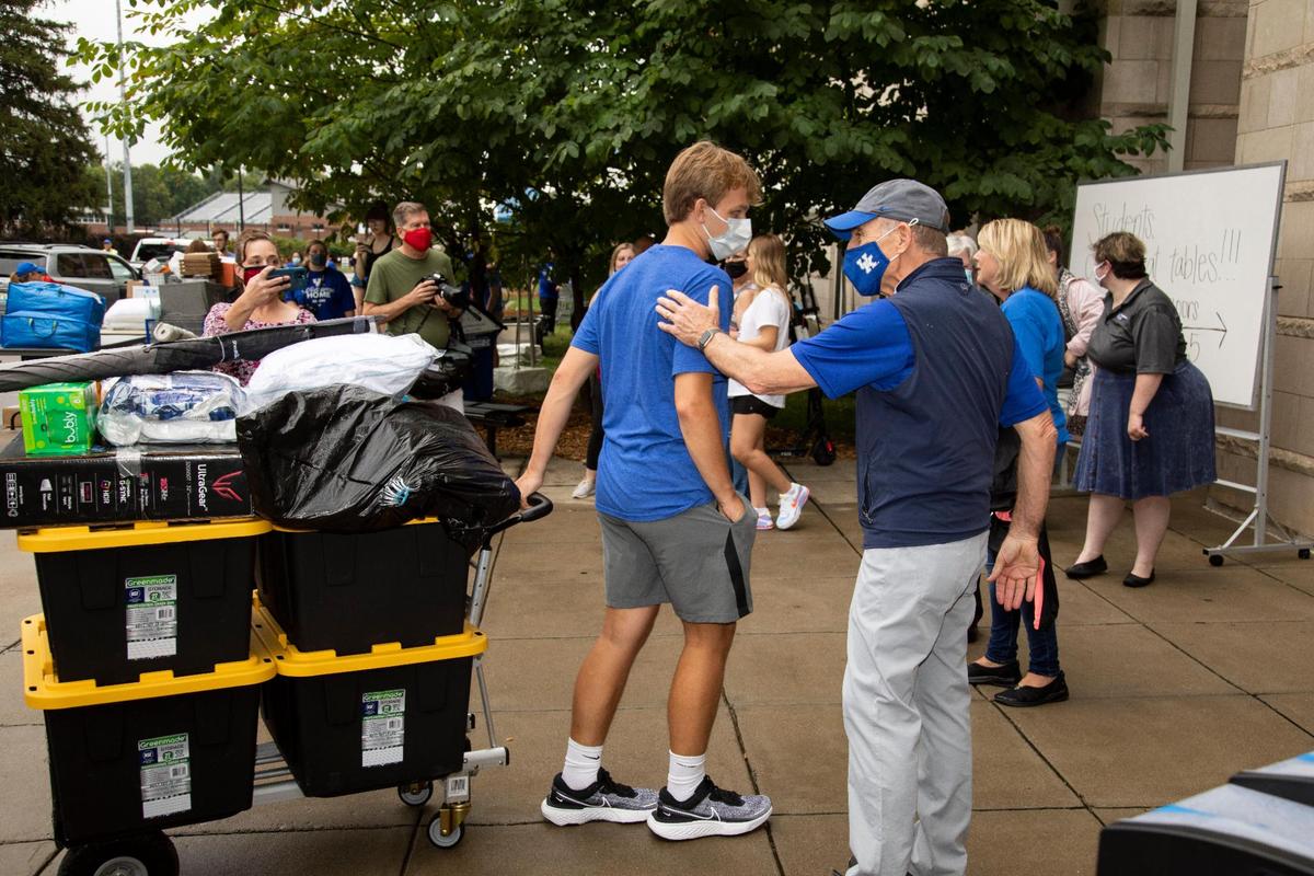 University of Kentucky President Eli Capilouto welcomes students as they move belonging into Woodland Glen III residence hall at the University of Kentucky in Lexington, Ky., Monday, August 16, 2021. According to Executive Director of Auxiliary Services, Sarah Nikirk 2,000 students will move in all over campus and 400 will move in at dorm Woodland Glen III.