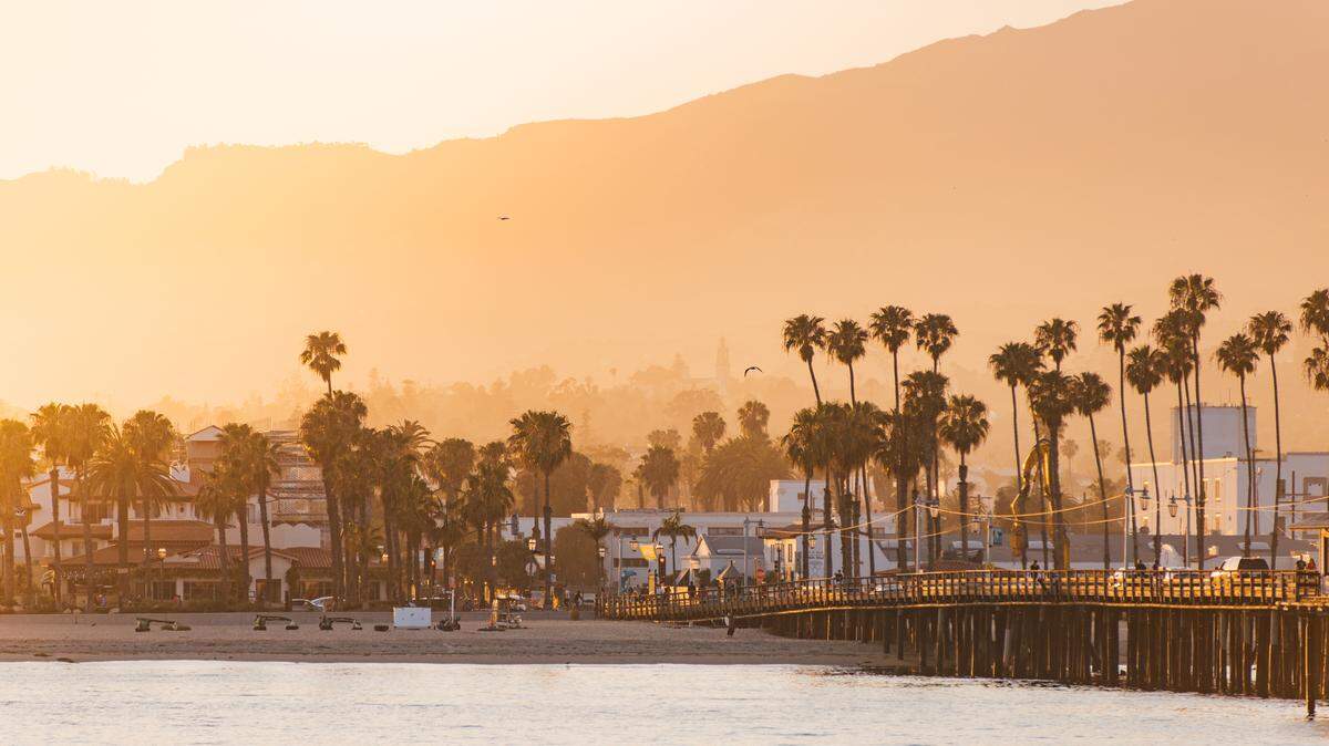 Stearns Wharf in Santa Barbara, at sunset, with the Santa Ynez Mountains in the background. Santa Barbara is often referred to as the American Riviera.