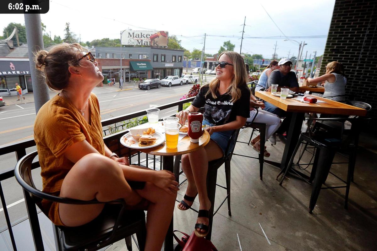 Bear & The Butcher restaurant has a second floor patio that overlooks the Chevy Chase neighborhood.
