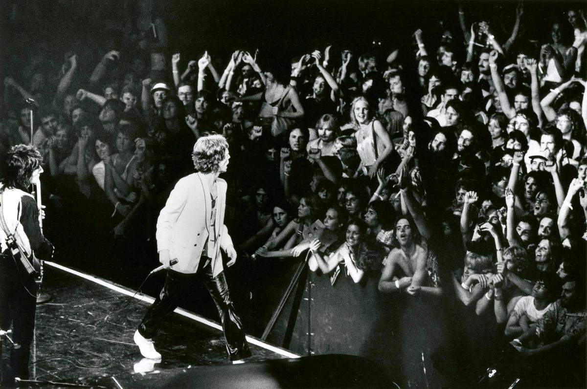 The Rolling Stones performed in Rupp Arena on June 29, 1978, during their Some Girls Tour. At left, Ron Wood played guitar as Mick Jagger worked the crowd. The U.S. tour was 24 shows, and Lexington was the 11th stop. It was one of the first big concerts in the young history of Rupp Arena, which opened in 1976. It was the first Rupp Arena concert where all the tickets were not sold on a reserved seating basis. The band played 19 songs for the sold-out crowd.