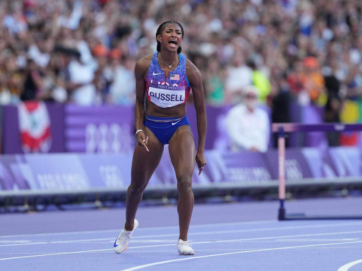 Aug 10, 2024; Saint-Denis, FRANCE;  Masai Russell (USA) celebrates after winning the women's 100m hurdles final during the Paris 2024 Olympic Summer Games at Stade de France. Mandatory Credit: James Lang-USA TODAY Sports