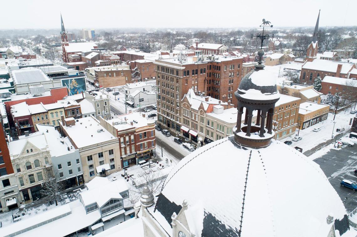 The weathervane atop the Old Fayette County Court House and the rest of downtown sit under a blanket of snow, Friday, Jan. 7, 2022.