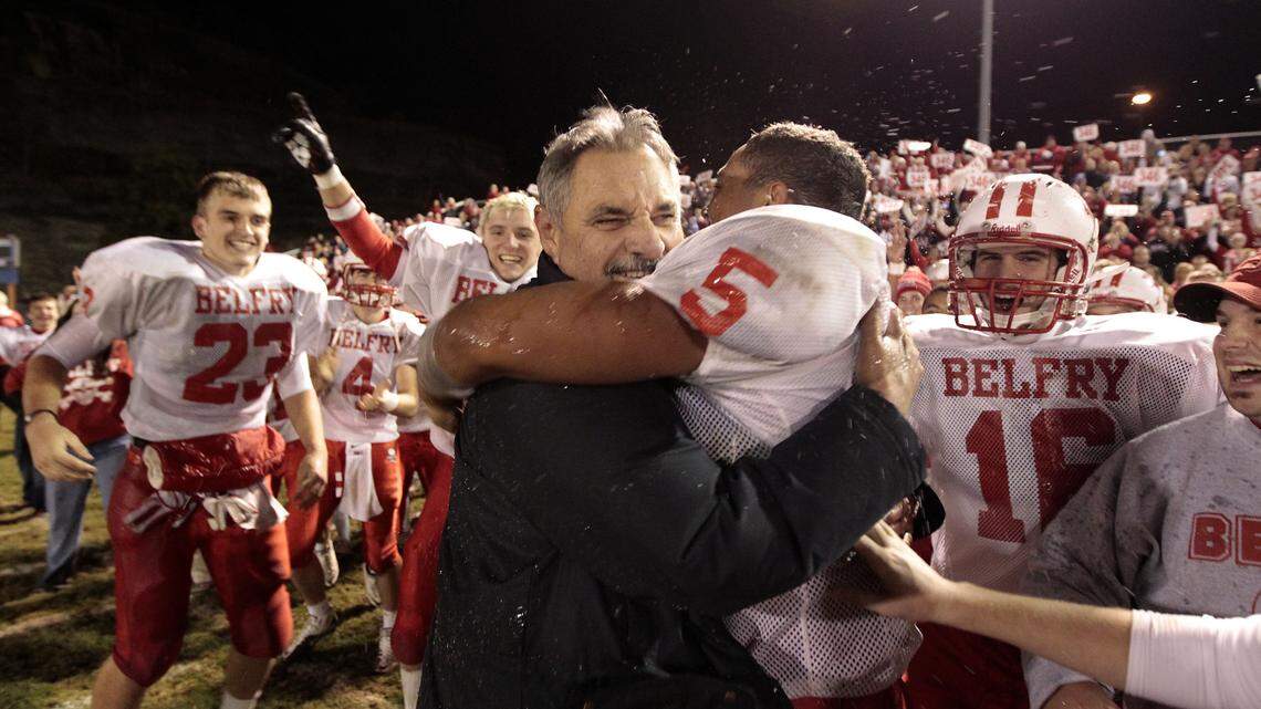 Belfry head coach Philip Haywood hugged Gary Runyon and other players as Belfry defeated Pike County Central in Pikeville in 2011. The game made Haywood the winningest football coach in state history. He'll have a Class 3A championship contender again this season.  