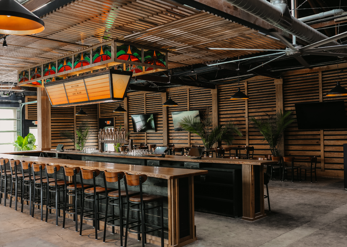 Burl Brew will open on March 1 with a central 30-seat bar made from a single oak tree. The bar also has table seating and will serve cocktails.