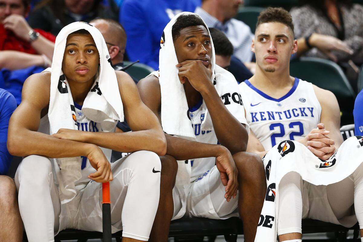 Kentucky’s Keldon Johnson, left, Ashton Hagans, middle, and Reid Travis sat dejected on the bench during the Wildcats’ 118-84 season-opening loss to Duke at the Champions Classic in Indianapolis on Tuesday night. It was the most lopsided UK loss since a 93-52 blowout at Vanderbilt on Feb. 12, 2008.