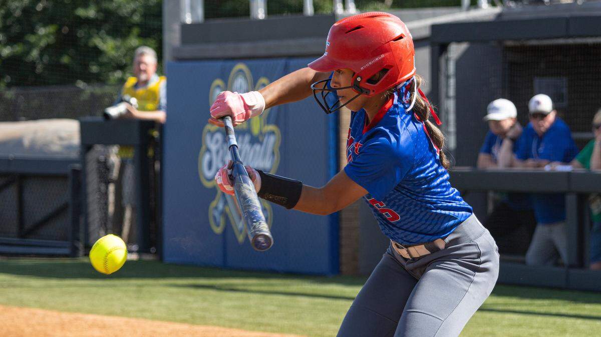 Madison Central's Reille bunts the ball at home plate during the UK HealthCare Softball State Tournament first round game between Madison Central and Lawrence County at John Cropp Stadium in Lexington, Ky, on June 4, 2026