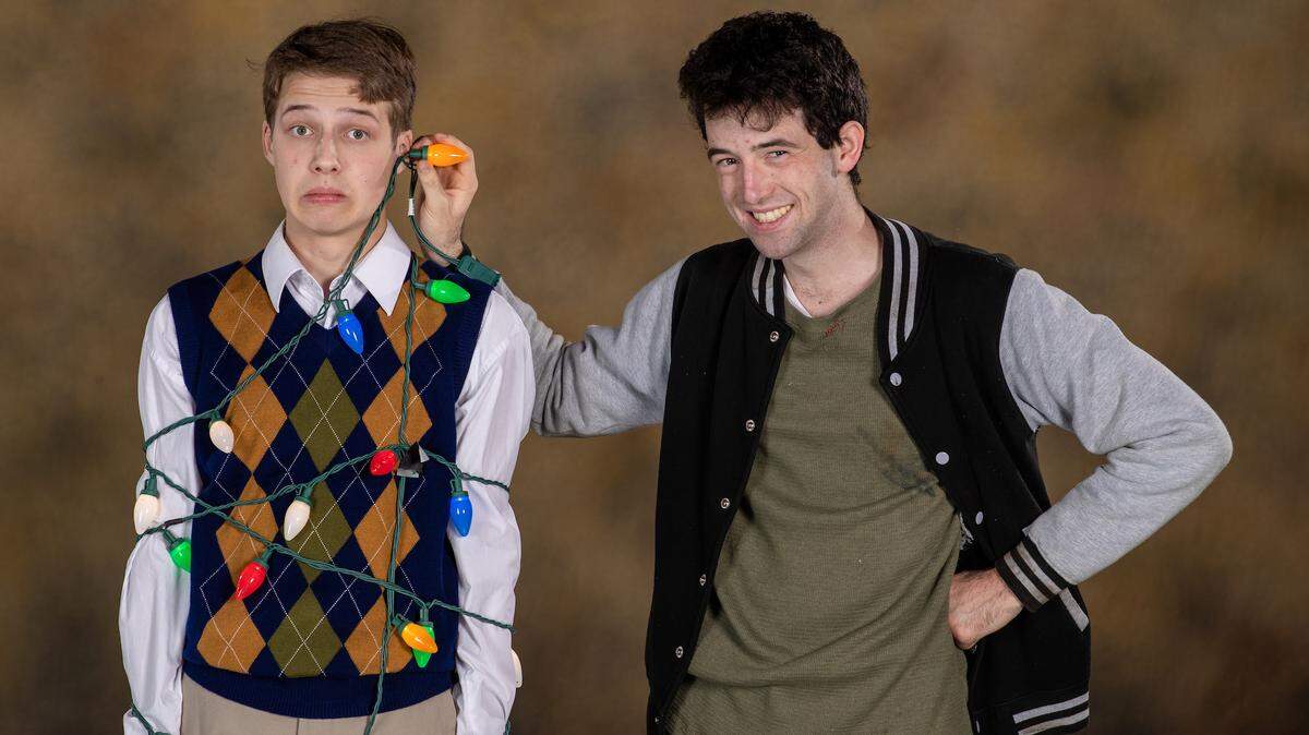 Taggert Robinson, right, as Ralph Herdman, targets Nick Baker as Elmer Hopkins, as a human Christmas tree in Lexington Children’s Theatre production of ‘The Best Christmas Pageant Ever: The Musical.’