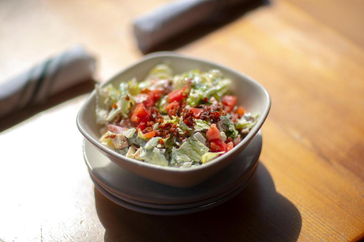 Malone’s Lexingtonian salad includes a mix of romaine and iceberg lettuce with tomatoes, warm bacon and a creamy house dressing.