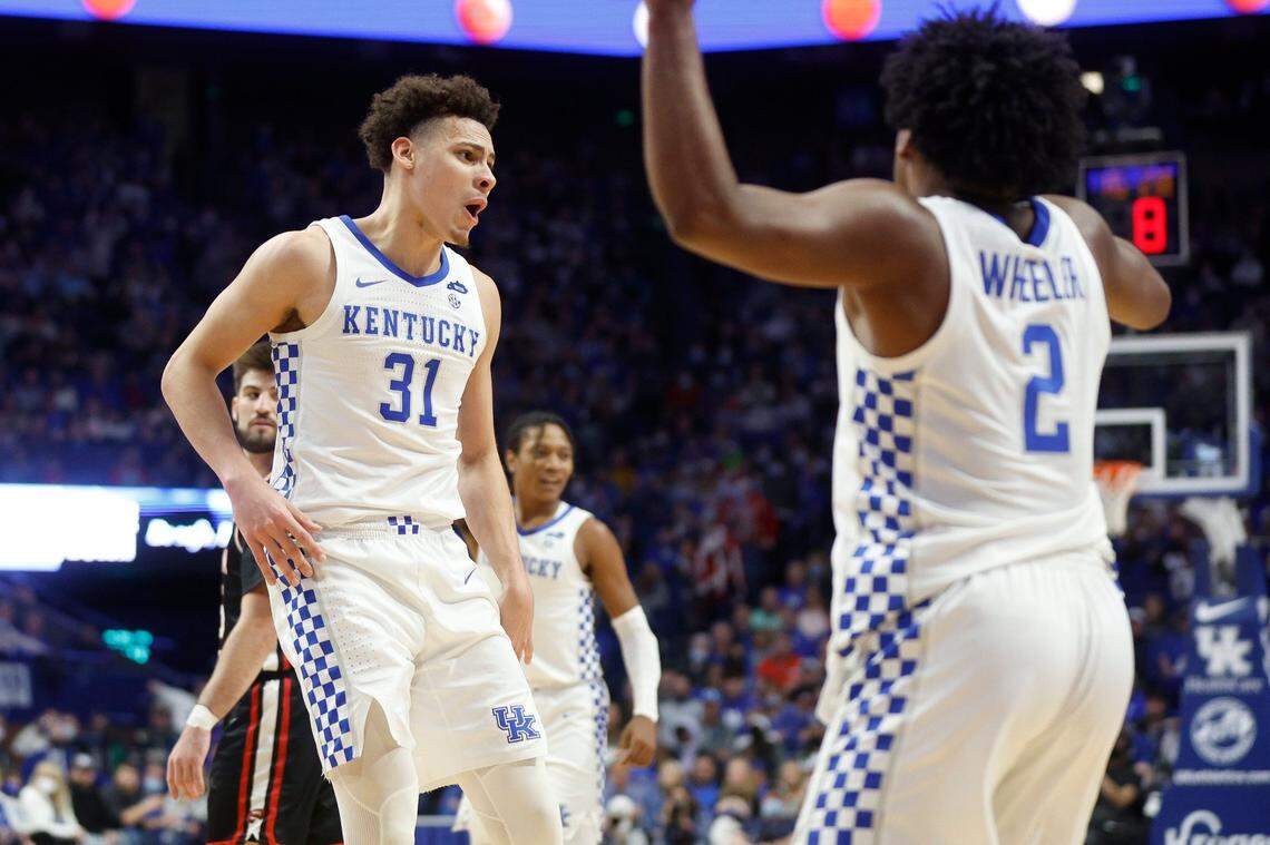 Kentucky’s Kellan Grady (31), who celebrated with Sahvir Wheeler (2) during Wednesday’s win against WKU, has hit 11 three-pointers in his past two games.