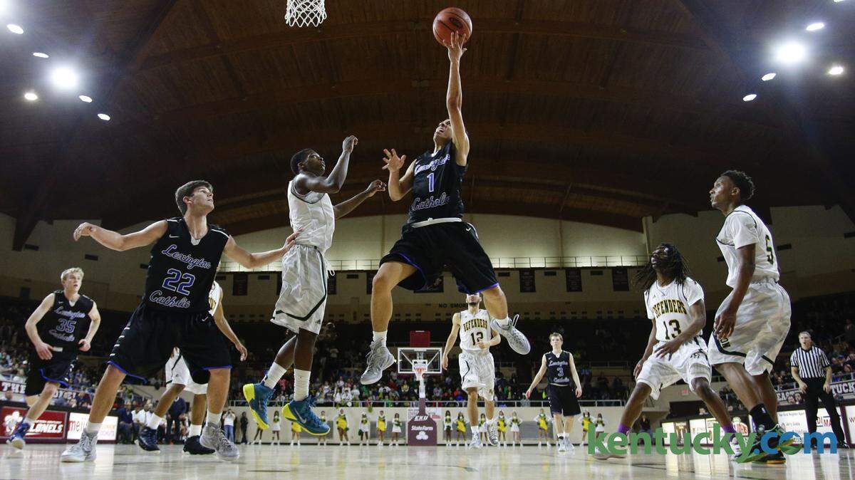 Lexington Catholic's Michael Talbott drove the lane for  a layup as Lexington Catholic defeated Bryan Station in the 11th Region championship on Tuesday March 10, 2015 in Richmond, Ky. Photo by Mark Cornelison










