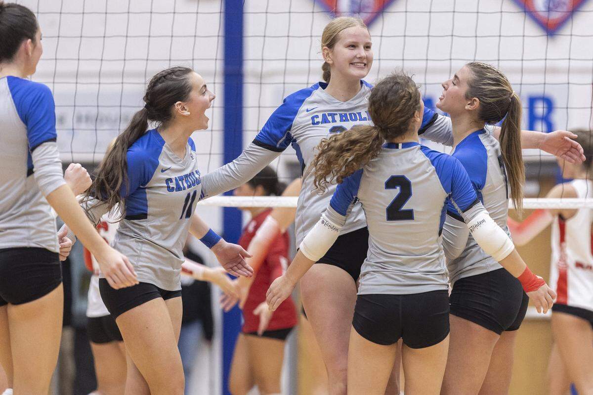 Lexington Catholic's Ella Blackburn (11), from left, Miller Duncan, Finley Quinn (2) and Charlotte Hall celebrate during their match against Paul Laurence Dunbar in the 11th Region Tournament championship game at Madison Central High School on Oct. 31, 2024.