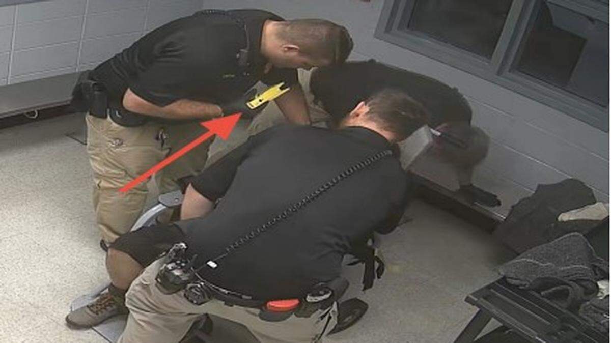 Former Madison County Detention Center Captain James Hollins uses a Taser on Mansfield.