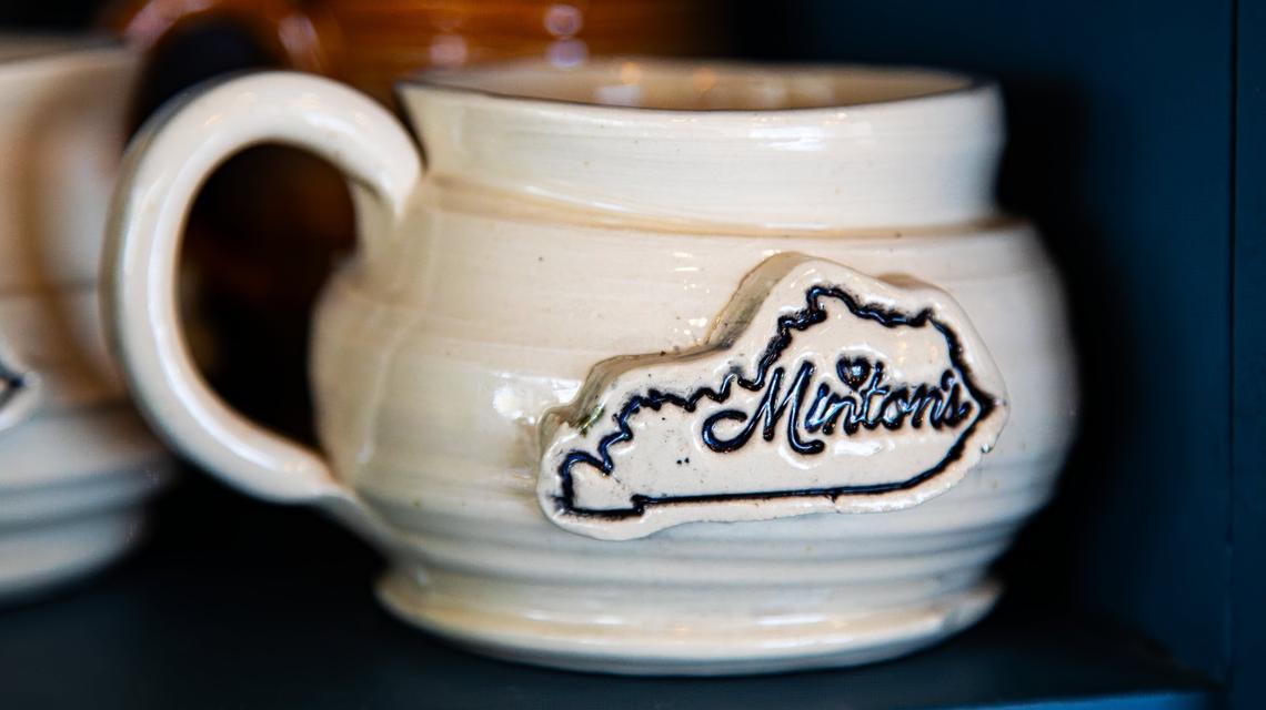 Custom-made coffee mugs complement Minton’s new 701 National Ave location.