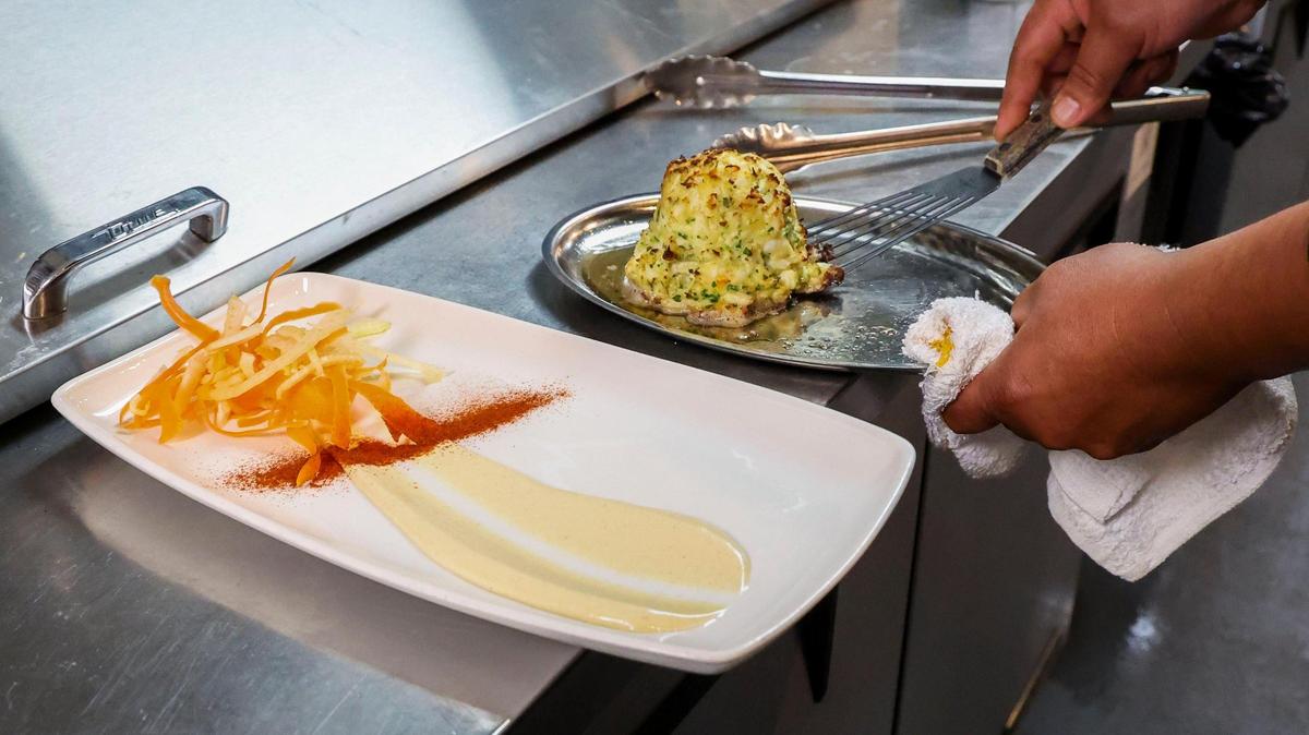 A Jumbo Lump Crab Cake appetizer after it has come out of an oven, Tuesday, June 10, 2025 at Tony’s of Lexington in downtown Lexington, Ky. On typical evening, the restaurant will sever about 100 crab cakes and 150 on busy nights.
