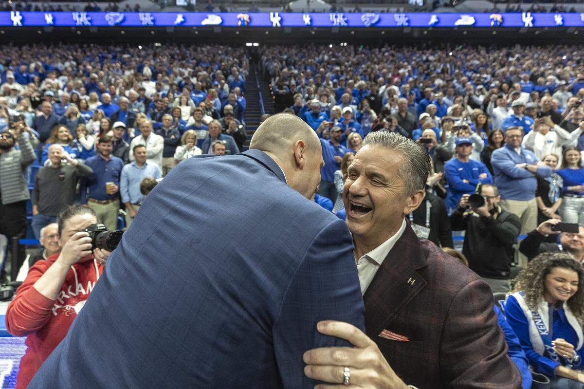 Kentucky’s Mark Pope and Arkansas’ John Calipari greet each other before Saturday night’s game in Rupp Arena.