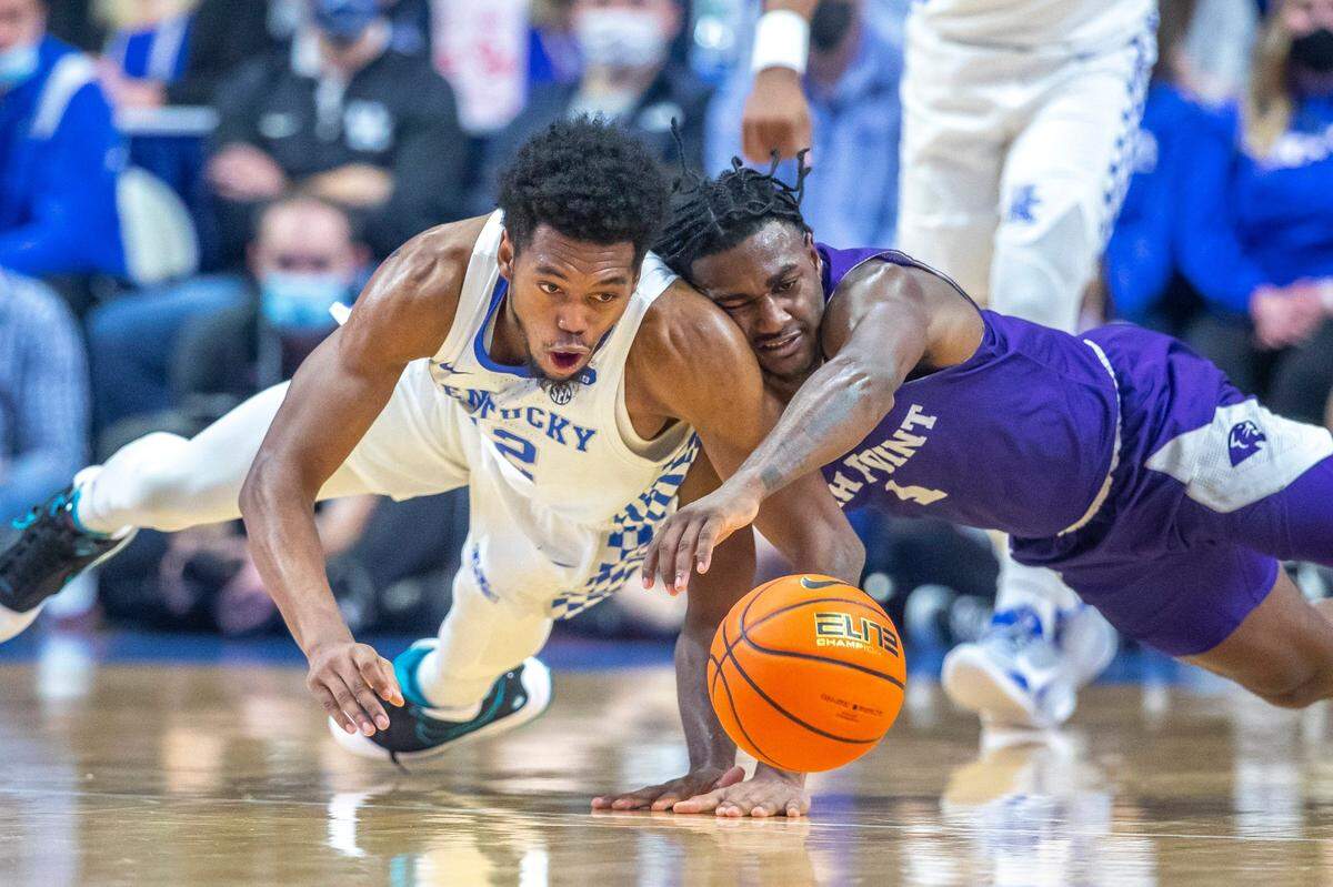 Kentucky’s Keion Brooks, left, and High Point’s John-Michael Wright battled for the ball during Friday’s game. Brooks finished with nine points, seven rebounds and three assists.