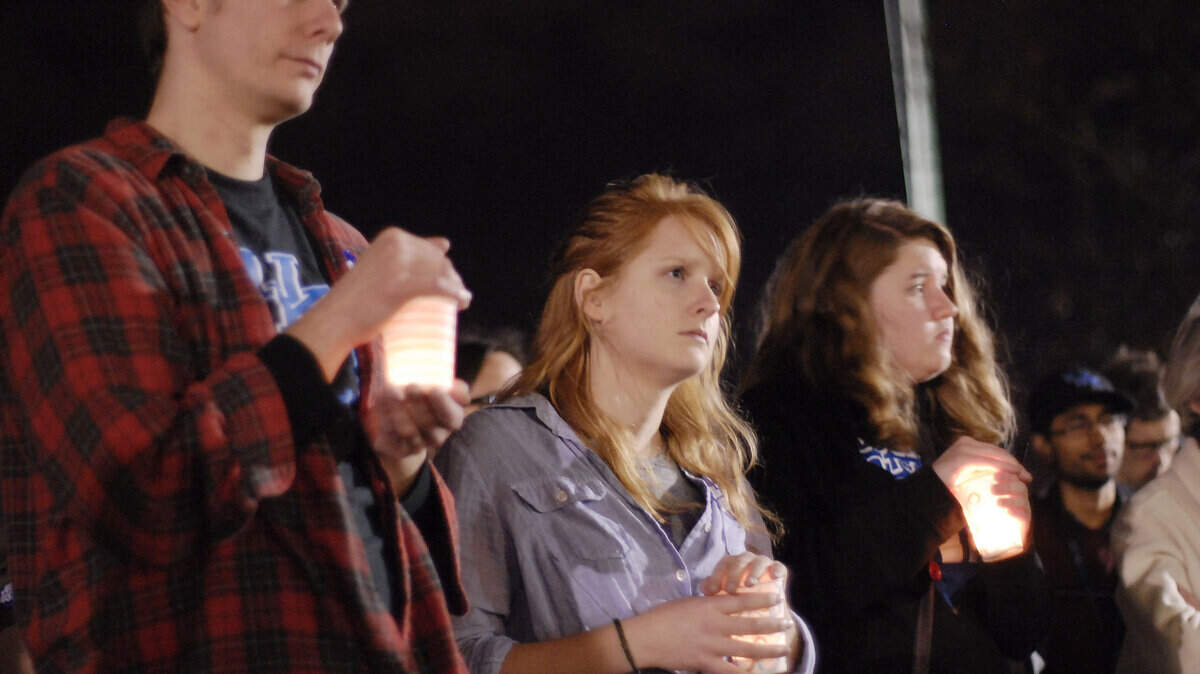 The University of Kentucky student group United Students Against Sweatshops had an interfaith candlelight vigil Monday for workers who have died in the garment industry. The vigil, on UK's main lawn, was intended to encourage President Capilouto to affiliate UK with an independent watchdog group called the Workers Rights Consortium. Photo by Mark Ashley